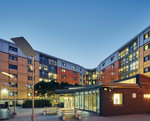 Large student residence building in the evening